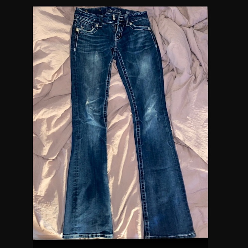 Gently used Miss Me dark washed low rise boot cut jeans